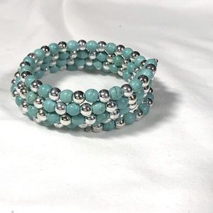 Memory bracelet with turquoise and silver color beads.